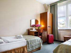 Postel nebo postele na pokoji v ubytování Hotel Galicya