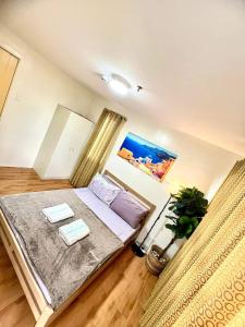 a bedroom with a bed and a potted plant at Davao Condo 2BR Pool Wifi Netflix in Davao City +79 photos