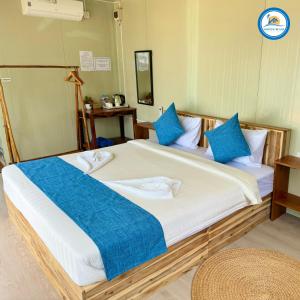 Postel nebo postele na pokoji v ubytování Naroth Beach Bungalow