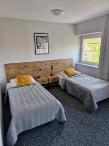 Posteľ alebo postele v izbe v ubytovaní Hostel Relaks