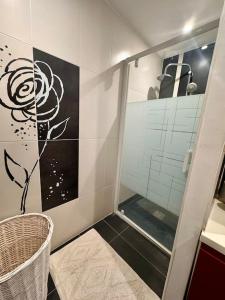 a bathroom with a shower with a glass door at La Maison de Sainte-Eulalie in Roubia +3 photos