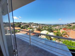 a balcony with a view of a city at Recanto k9 unidade 2 in Serra Negra