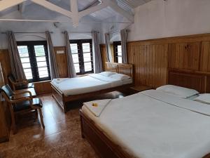 Letto o letti in una camera di Trilan Cottages - Donnington Road