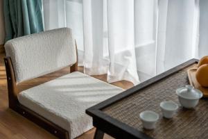 Postel nebo postele na pokoji v ubytování 山田心精品民宿 Valley Heart Inn