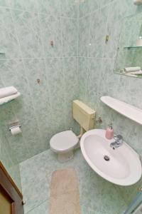 Koupelna v ubytování Apartments Ive