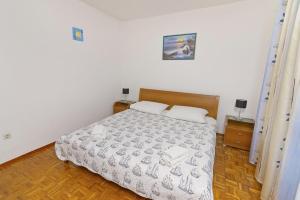 Postel nebo postele na pokoji v ubytování Apartments Ive