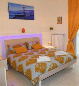 A bed or beds in a room at Antonella home b&b