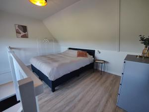 Postel nebo postele na pokoji v ubytování B&B de Gouden Ploeg met Jacuzzi