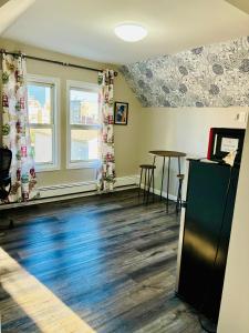 an empty room with a table and a window at Van Buren Gem 2.0 in Newark