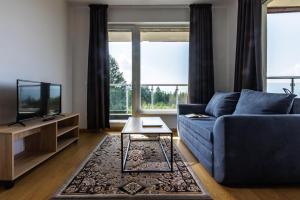 TV a/nebo společenská místnost v ubytování Saint George Palace Aparthotel