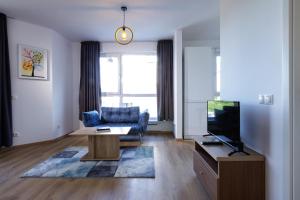 TV a/nebo společenská místnost v ubytování Saint George Palace Aparthotel
