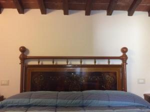 A bed or beds in a room at Agriturismo Podere Fiume