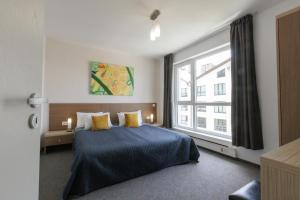 Postel nebo postele na pokoji v ubytování Saint George Palace Aparthotel