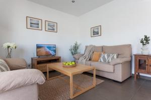 a living room with a couch and a coffee table at Casa Alexandra in L'Escala +21 photos