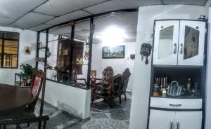 a room with a table and a dining room at My second house in Manizales