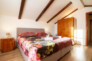 a bedroom with a large bed in a room at Woodland Retreat in Donji Zagon +32 photos