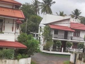a view of two buildings with red roofs at hancy homestay in Gampaha