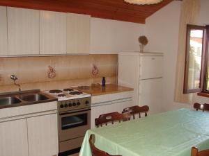 Kuchyň nebo kuchyňský kout v ubytování Apartments Dragan