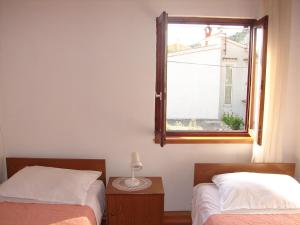 Postel nebo postele na pokoji v ubytování Apartments Dragan