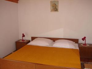 Postel nebo postele na pokoji v ubytování Apartments Dragan