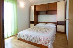 Posteľ alebo postele v izbe v ubytovaní Apartments Ana