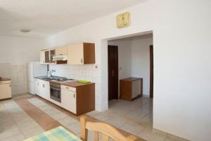 Kuchyň nebo kuchyňský kout v ubytování Apartments Ana