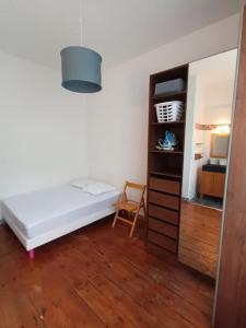 Ένα ή περισσότερα κρεβάτια σε δωμάτιο στο Charmant T2 place de Verdun