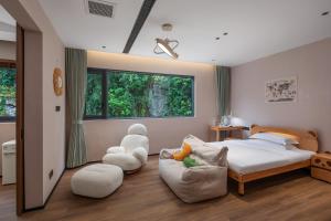Postel nebo postele na pokoji v ubytování Dyed Mount Boutique Hotel