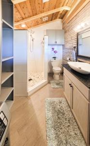 a bathroom with a toilet and a sink and a shower at Cozy Coastal Retreat in Port Lavaca