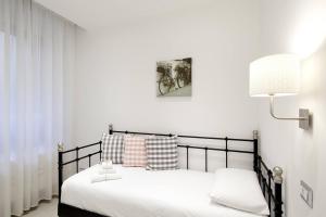 A bed or beds in a room at Affittacamere Arosio