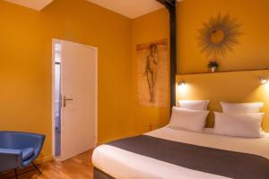 Postel nebo postele na pokoji v ubytování Hôtel Helzear Montparnasse