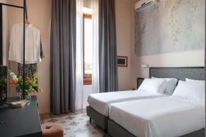 Postel nebo postele na pokoji v ubytování Hotel Fiorita + 37 fotografií