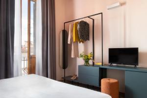 Postel nebo postele na pokoji v ubytování Hotel Fiorita