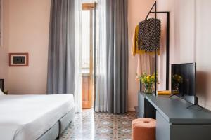 Postel nebo postele na pokoji v ubytování Hotel Fiorita