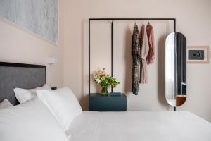Postel nebo postele na pokoji v ubytování Hotel Fiorita