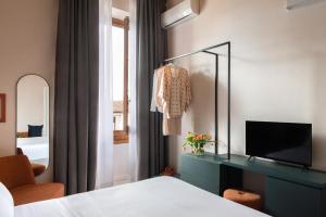 Postel nebo postele na pokoji v ubytování Hotel Fiorita