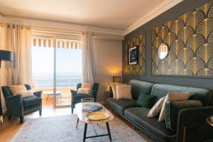 a living room with a green couch and chairs at Luxury Monte Carlo- Seaview, Champagne & AC in Beausoleil