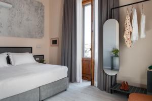 Postel nebo postele na pokoji v ubytování Hotel Fiorita
