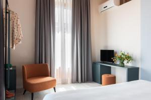 TV a/nebo společenská místnost v ubytování Hotel Fiorita