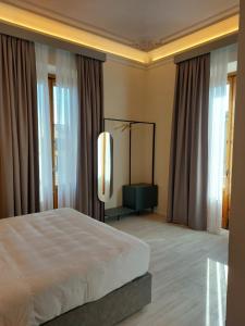 Postel nebo postele na pokoji v ubytování Hotel Fiorita