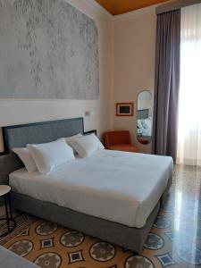 Postel nebo postele na pokoji v ubytování Hotel Fiorita