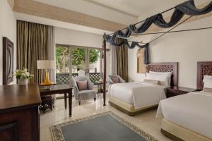 Voodi või voodid majutusasutuse Sharq Village & Spa, a Ritz-Carlton Hotel toas
