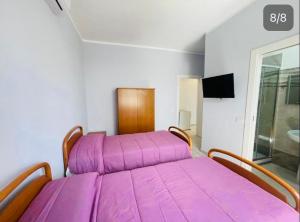 Postel nebo postele na pokoji v ubytování Affitta Camere Mattia Mottola
