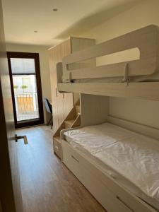 Postel nebo postele na pokoji v ubytování Apartament MOIXERA de Molló Parc