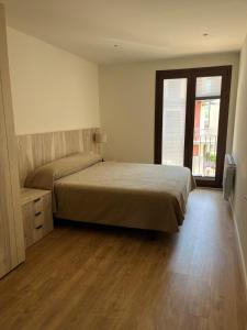 Postel nebo postele na pokoji v ubytování Apartament MOIXERA de Molló Parc
