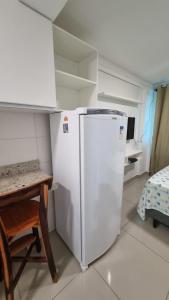 Kuchyň nebo kuchyňský kout v ubytování Confortável Flat com piscina de borda infinita na cobertura