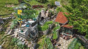 an aerial view of a house and a roller coaster at Brvnara Orlovo Gnezdo in Rudno