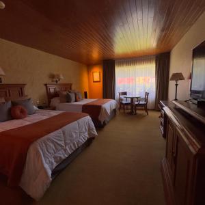 Postel nebo postele na pokoji v ubytování Hotel El Paraiso