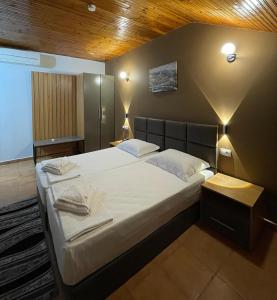 Postel nebo postele na pokoji v ubytování Hotel Milano