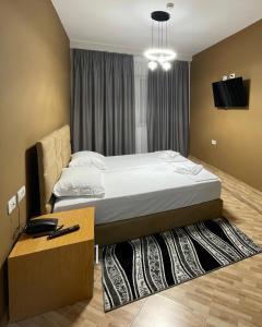 Postel nebo postele na pokoji v ubytování Hotel Milano